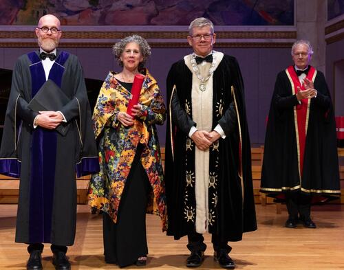 Laura Nasrallah at University of Oslo honorary degree conferral, flanked by the university's Dean of the Theological Faculty and Rector (President)